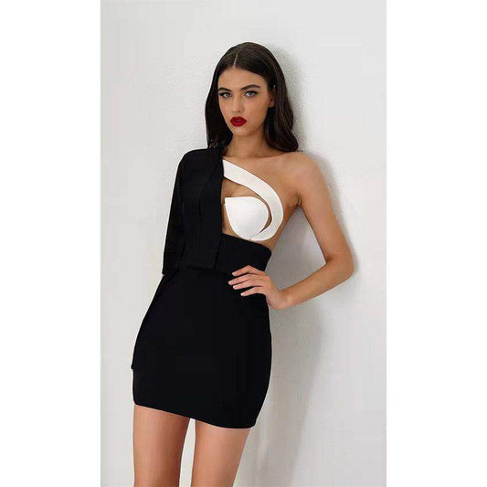 A Woman wearing a Fashion Custom Designed Black and White dress.